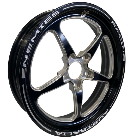 A black 17 inch Trickstar Frontrunner racing wheel with the text 'ENEMIES RACING' visible on the sidewall.